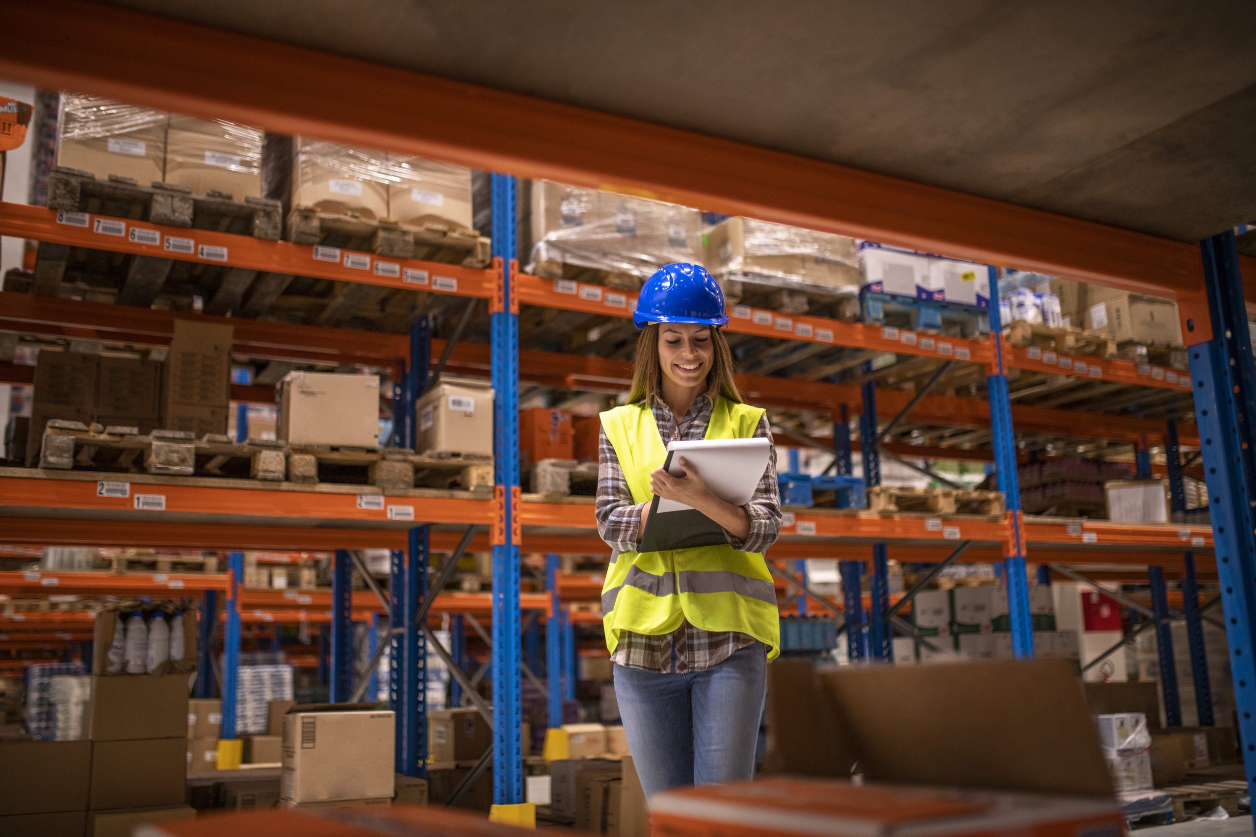 control aduana granefa line Warehouse female worker checking inventory in distribution warehouse.